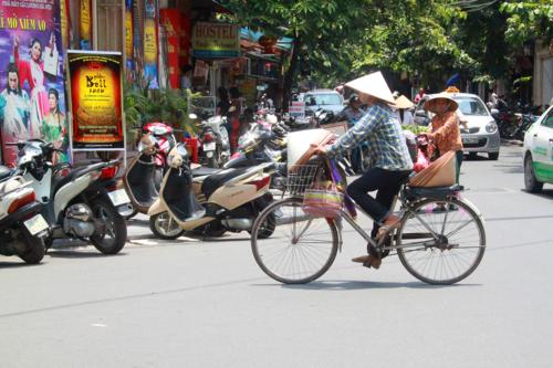 1915 Hat seller on bike.jpg