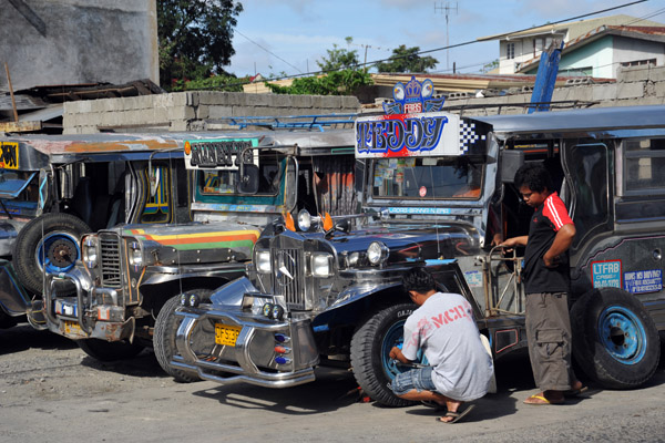 Fixing the tire of a Jeepney, Laoag City