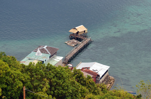 Wooden pier leading to a new-looking nipa hut, Culion