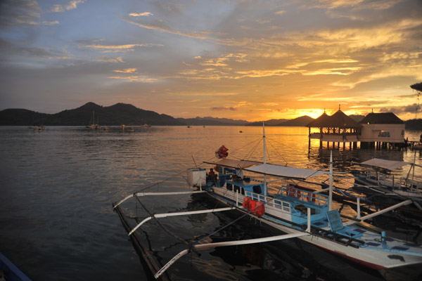 Seadive banca with sunset over Coron Bay