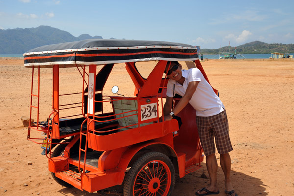 Dennis inspecting a tricycle, Coron