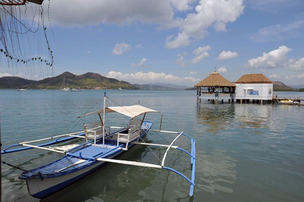 A small banca boat with La Sirenetta Restaurant, Coron Town