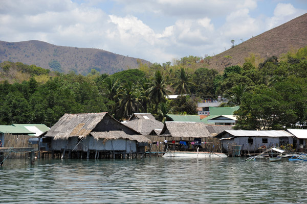 Thatched stilt houses along the Coron waterfront