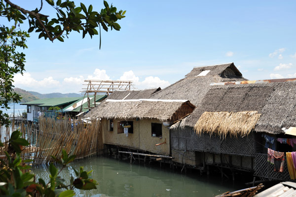Traditional thatched bamboo nipa huts on stilts, Coron Town