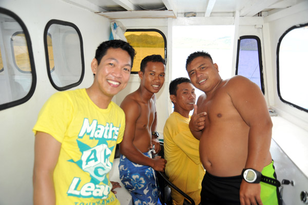 Dennis, the boat boy, captain and Toto, the divemaster