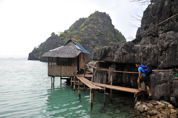 Stilt huts built around the Kayangan cove, Coron Island