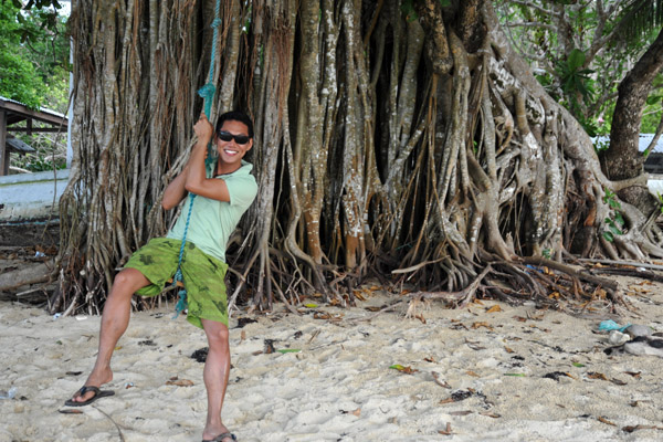 Swinging from a banyan tree, Ca'alan Beach