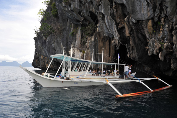 A large tourboat of Koreans at the entrance to Cathedral Cave