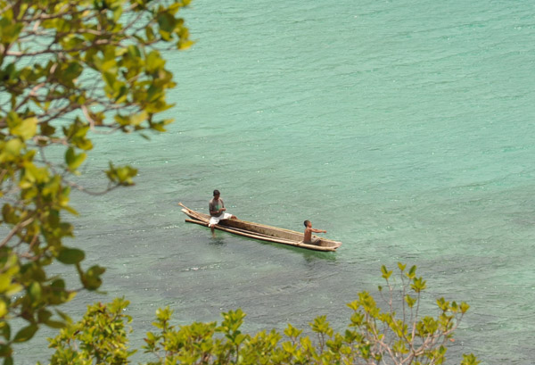 Boys fishing from a canoe near Snake Island