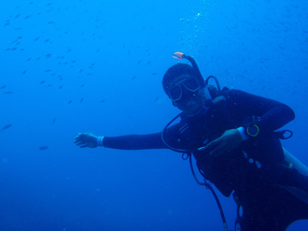 Dennis smiling under water
