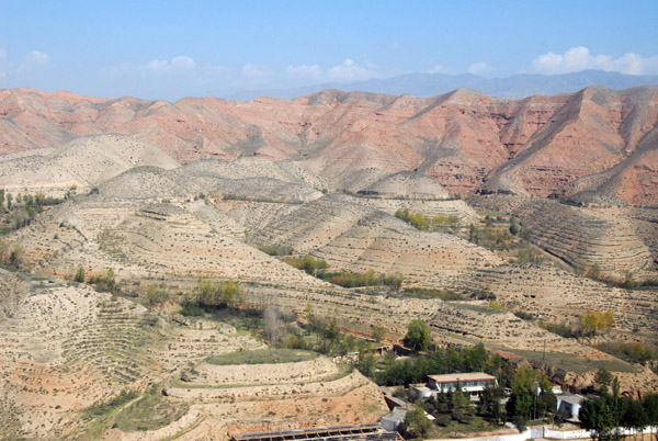 Terraced hillsides along short final landing to the west at Xining Caojiabao Airport (XNN)