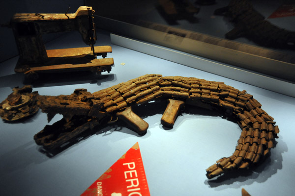 Crocodile make of old machine guns