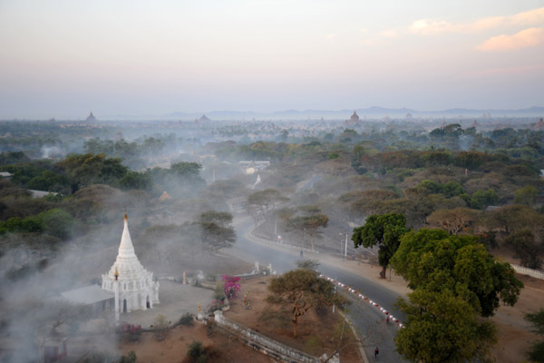 Early morning smoke from a fire as we float over the Bagan-Nyang U Road