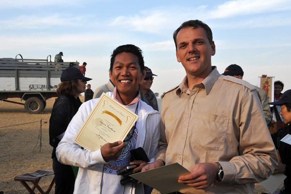 The pilot presents Dennis with his Balloon Flight Certificate, 2/2/2010