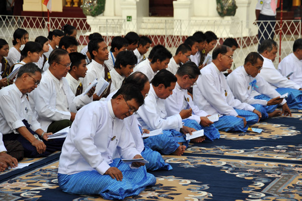 Burmese men praying at Shwedagon Paya