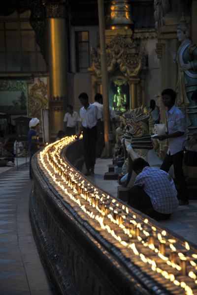 Candle-covered railing encircling the main stupa
