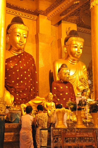 Large cloth-covered seated Buddhas