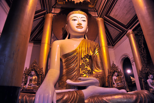 There is a punkah (a type of fan) over the Buddha that the faithful operate by rope to keep him cool in the heat