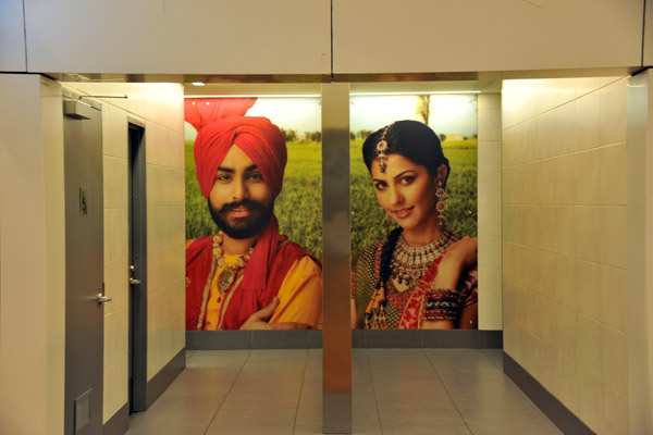 Terminal 3 uses a number of different portraits at the restroom entrance