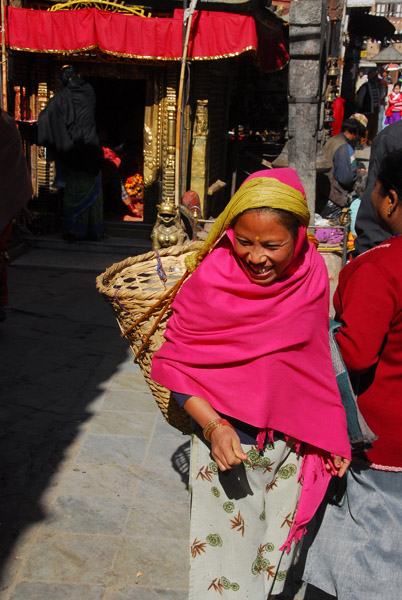 Woman carrying a basket in the Nepali style