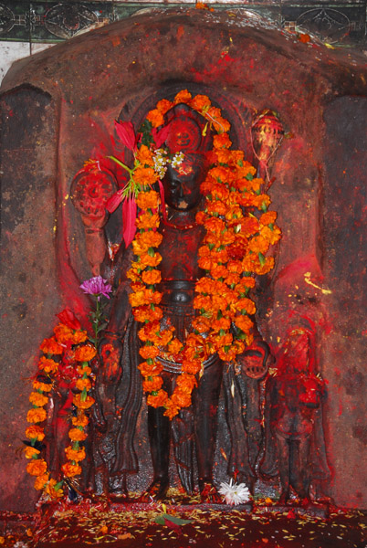 Flower draped temple image, Patan