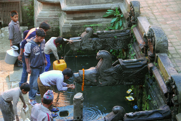 Manga Hiti, public water source with three stone carved makara, Durbar Square, Patan