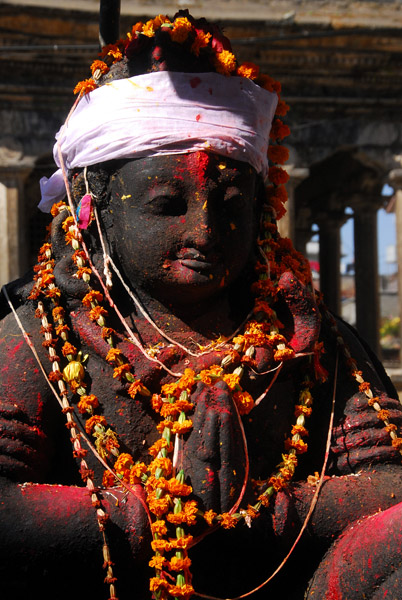 Garland covered Garuda near the guesthouse