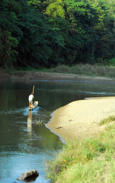 Man poling a canoe, Chitwan