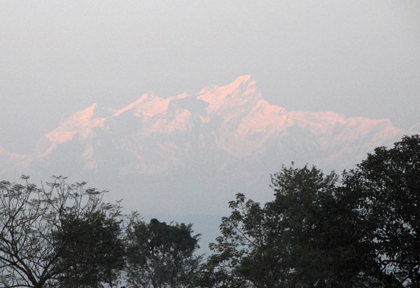 Distant Himalchuli (7893m/25,895ft) seen at sunset from Sauraha