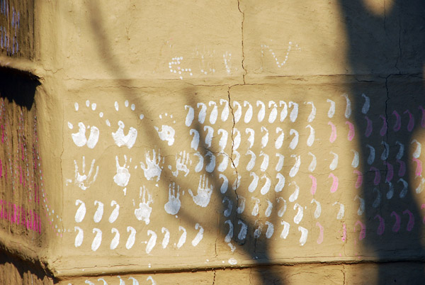 Interesting marks painted on the sides of a traditional Thamal house, Central Terai