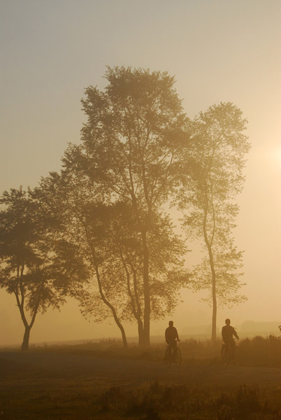 A pair of cyclists heading for Sauraha, early morning