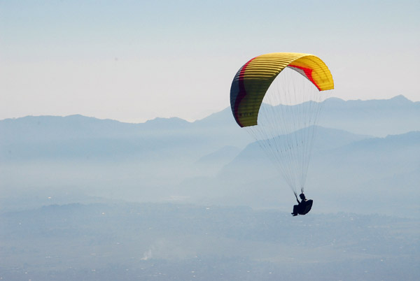 Paraglider flying from Sarangkot, north of Pokhara, Nepal