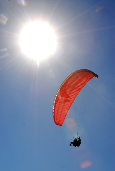 Paraglider with the sun