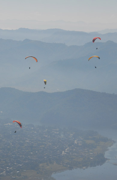 Five paragliders over Phewa Tal, Pohkhara