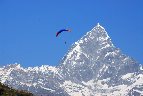 Paraglider with Machhapuchhare (6997m), Annapurna Range of the Himalaya