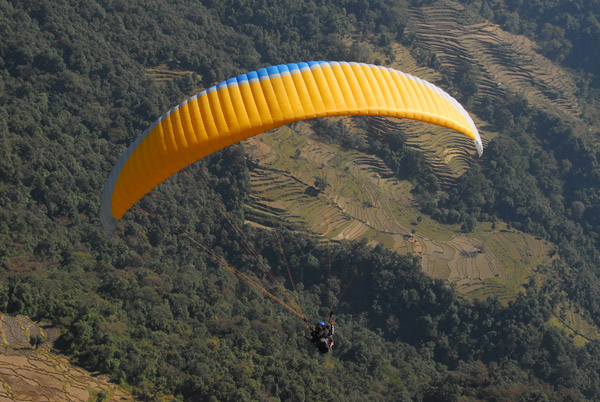 Paraglider with the terraces of Sarangkot