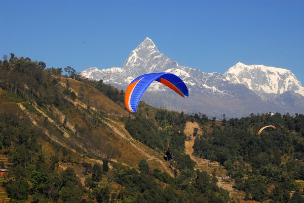 Paraglider with Sarangkot, Annapurna III and Machhapuchhare, Nepal
