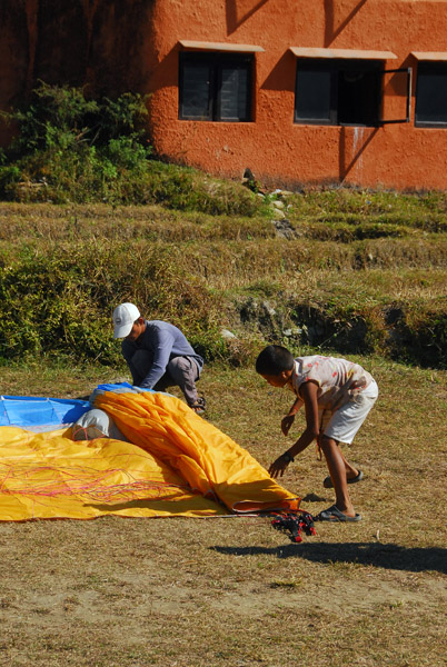 Boys packing up the gliders for transport back up the mountain