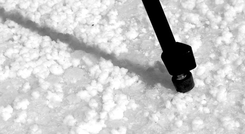 Joe Tripod standing on salt granules