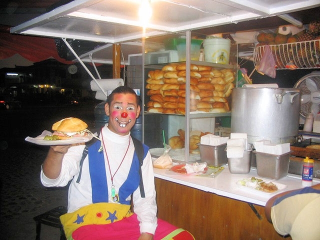 Mime eating a Cuban