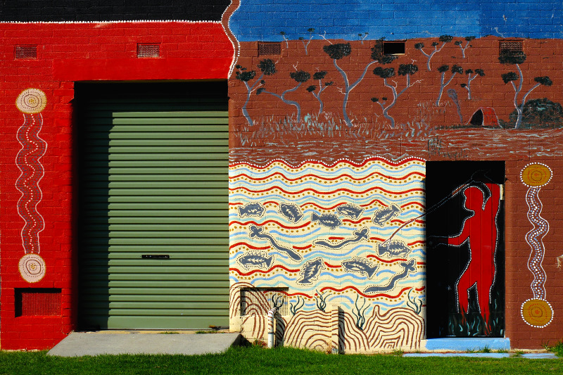 Green door in the mural