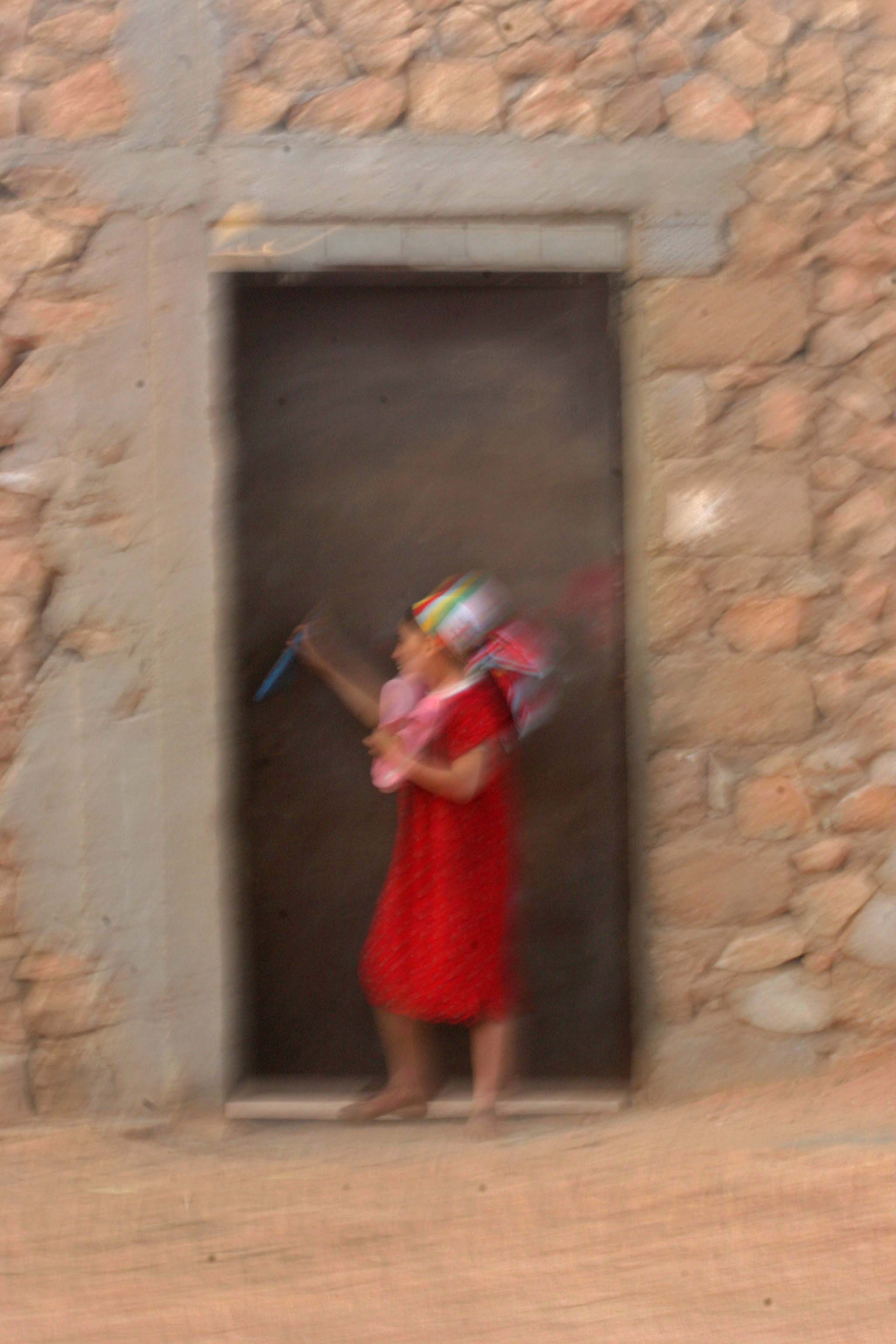 a beautifull girl by the doorstep.