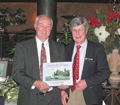 Rich DeGlopper (l), outgoing Club President,, receives a gift from Rocky Nagel (r)