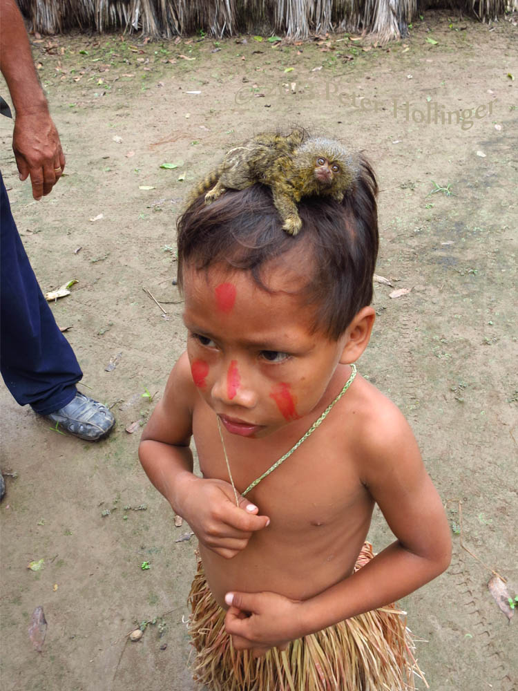 Yagua kid with baby pygmy marmoset