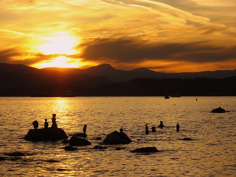 Inukshuks in English Bay during the sunset