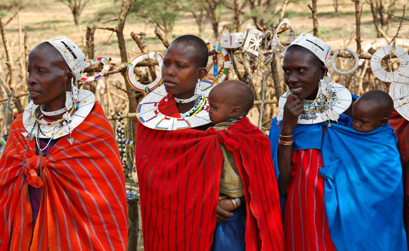 Masai women in traditional costumes with children 