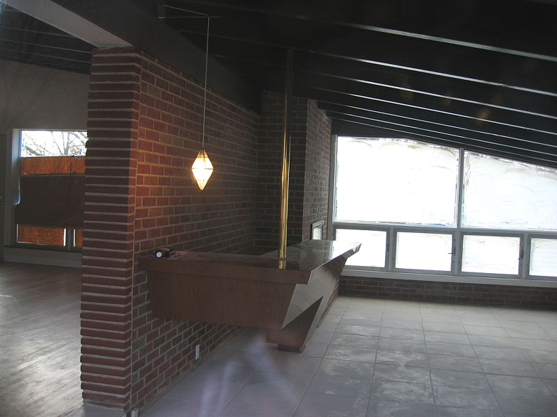 Bar shot from other side.  Aside from this room that has a cement floor, the rest of the house has hardwood.