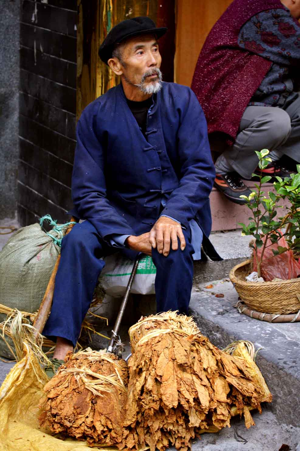 Selling tobacco leaves. Jishou City, Hunan Province, China