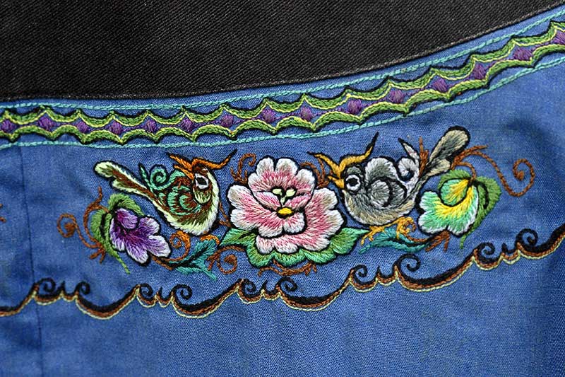 Hand embroidery representing her ancestors, which is normally seen on traditional Miao garmets.