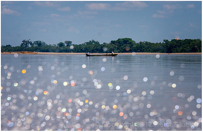 Canoe through spray.